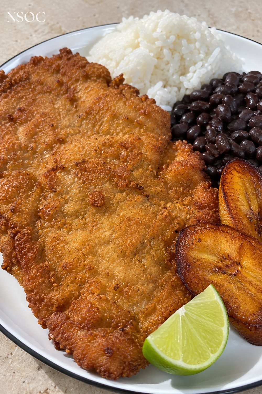 Vertical Pinterest pin of a breaded Cuban bistec empanizado, an example of NSOC campaign food photography