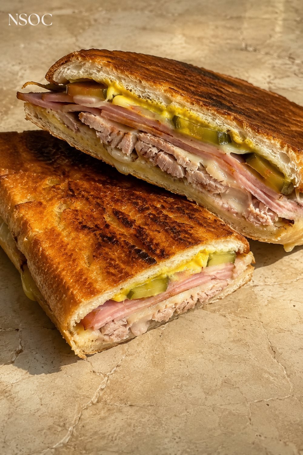 Vertical Pinterest pin of a pressed Cuban sandwich