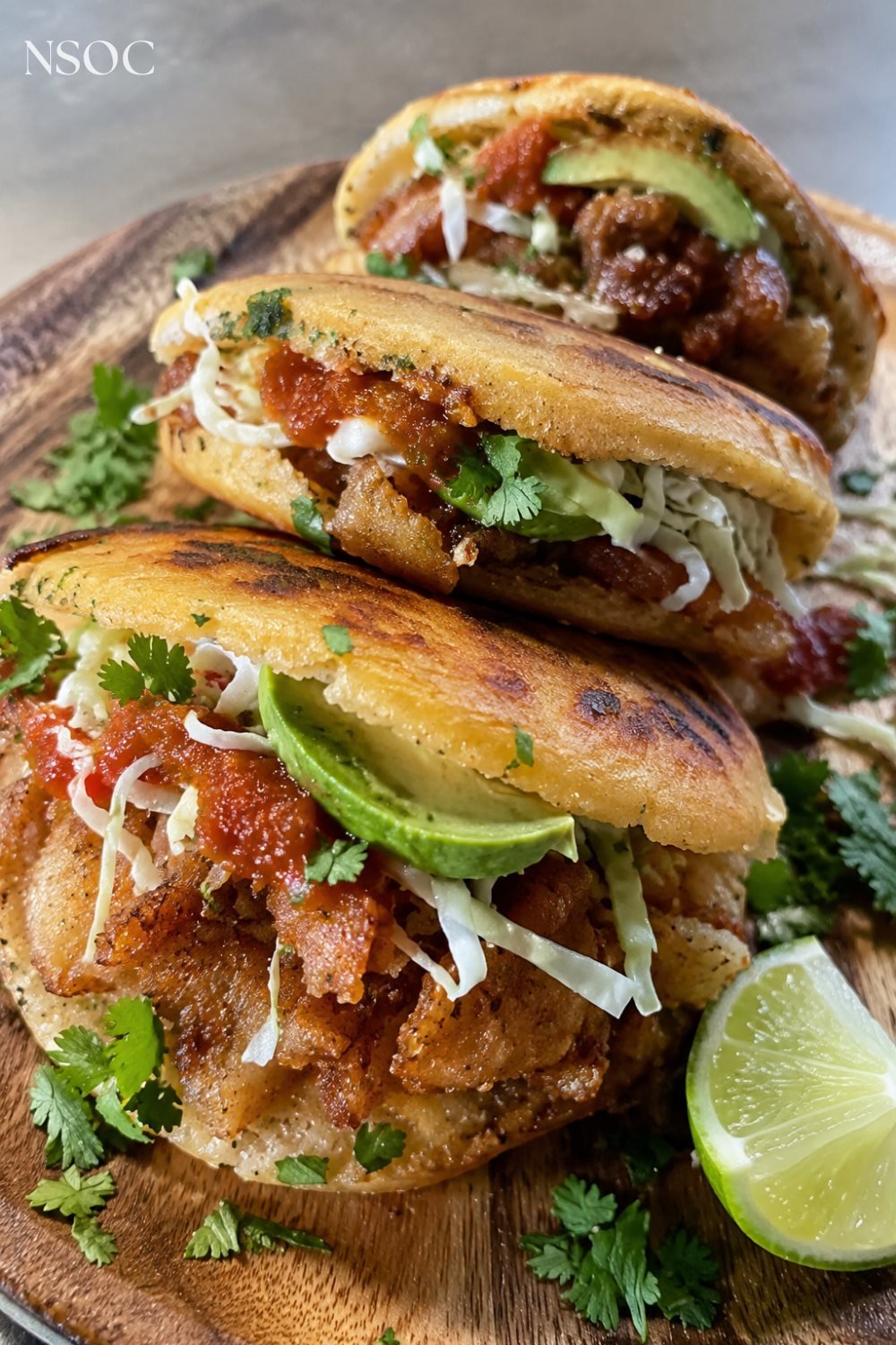 Vertical Pinterest pin of gorditas with chicharron, salsa and avocado