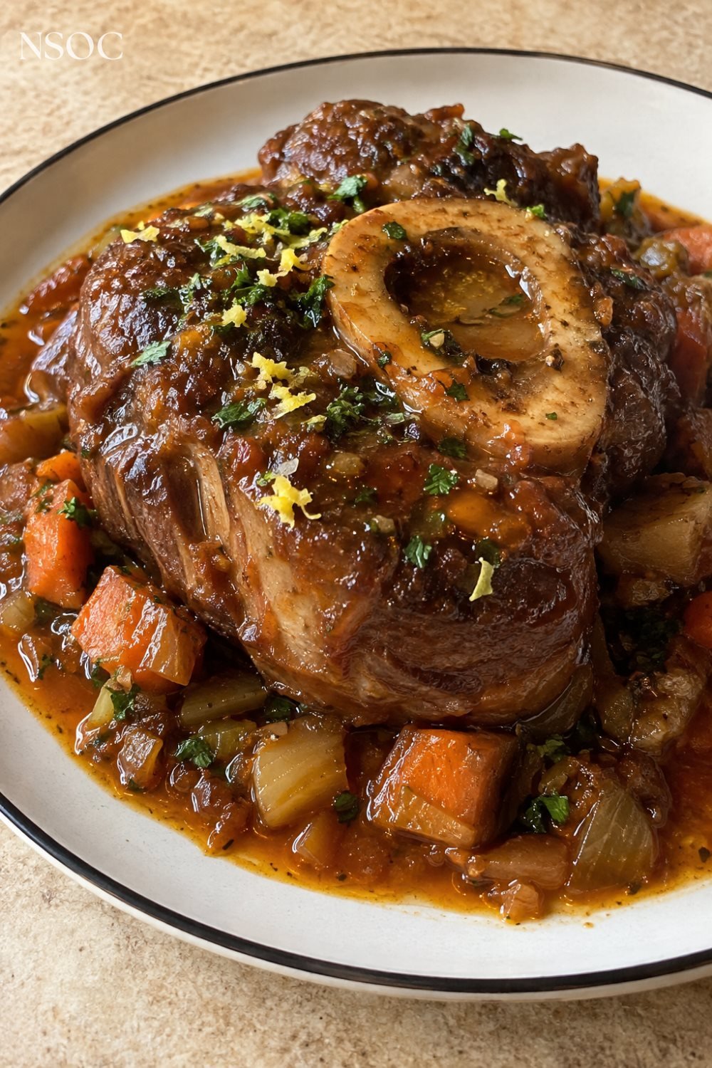Vertical Pinterest pin of a plated osso buco, an example of NSOC campaign food photography