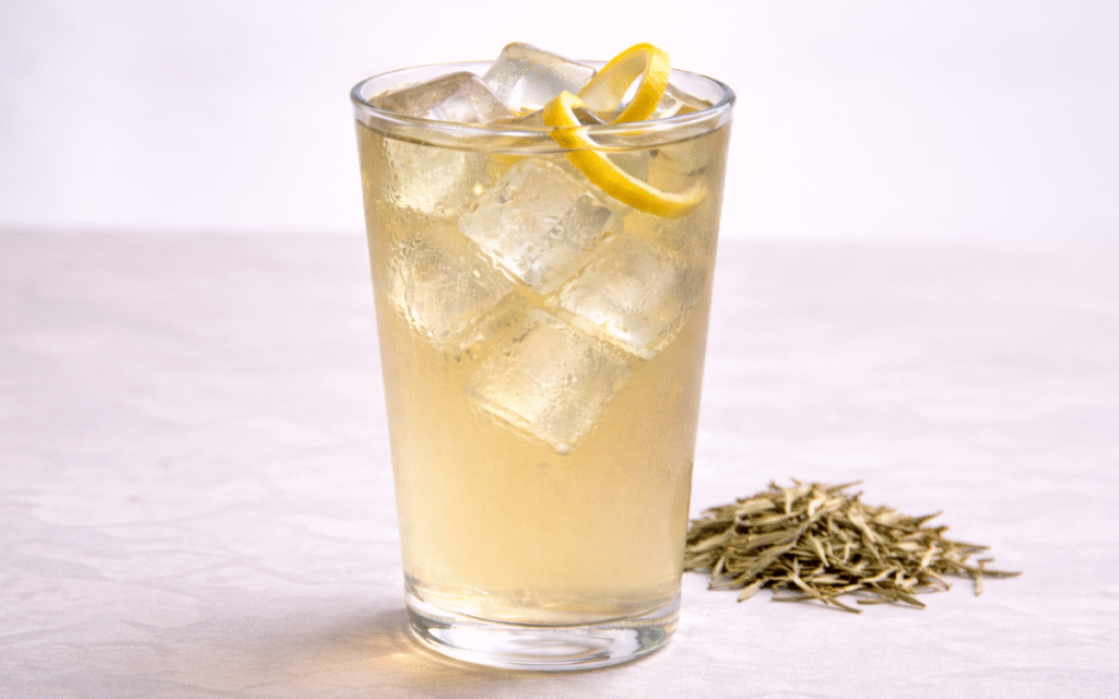 cold brew white tea served over ice with lemon peel twist