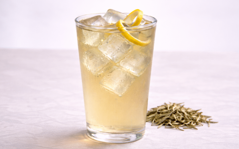 cold brew white tea served over ice with lemon peel twist