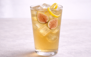 fig jasmine iced tea served over ice with fresh figs and lemon peel twists
