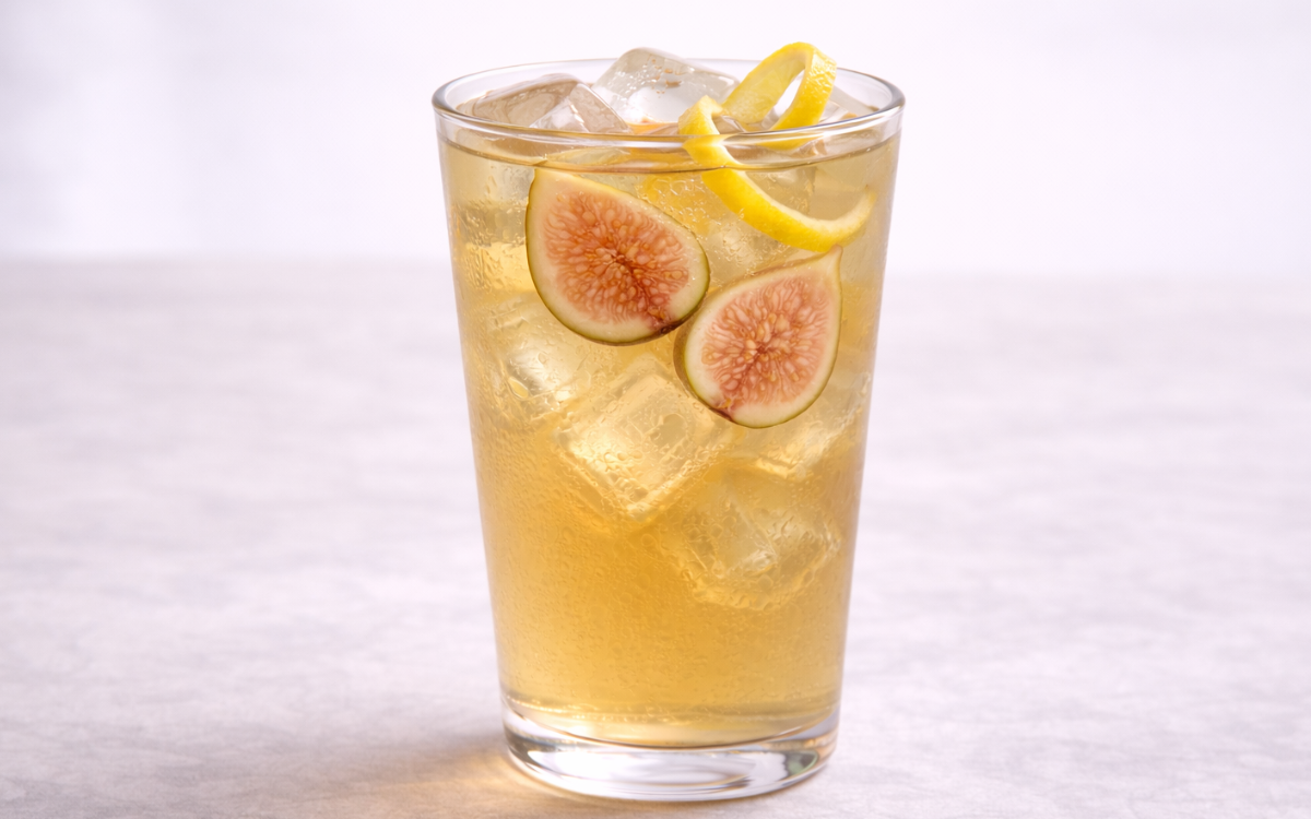 fig jasmine iced tea served over ice with fresh figs and lemon peel twists