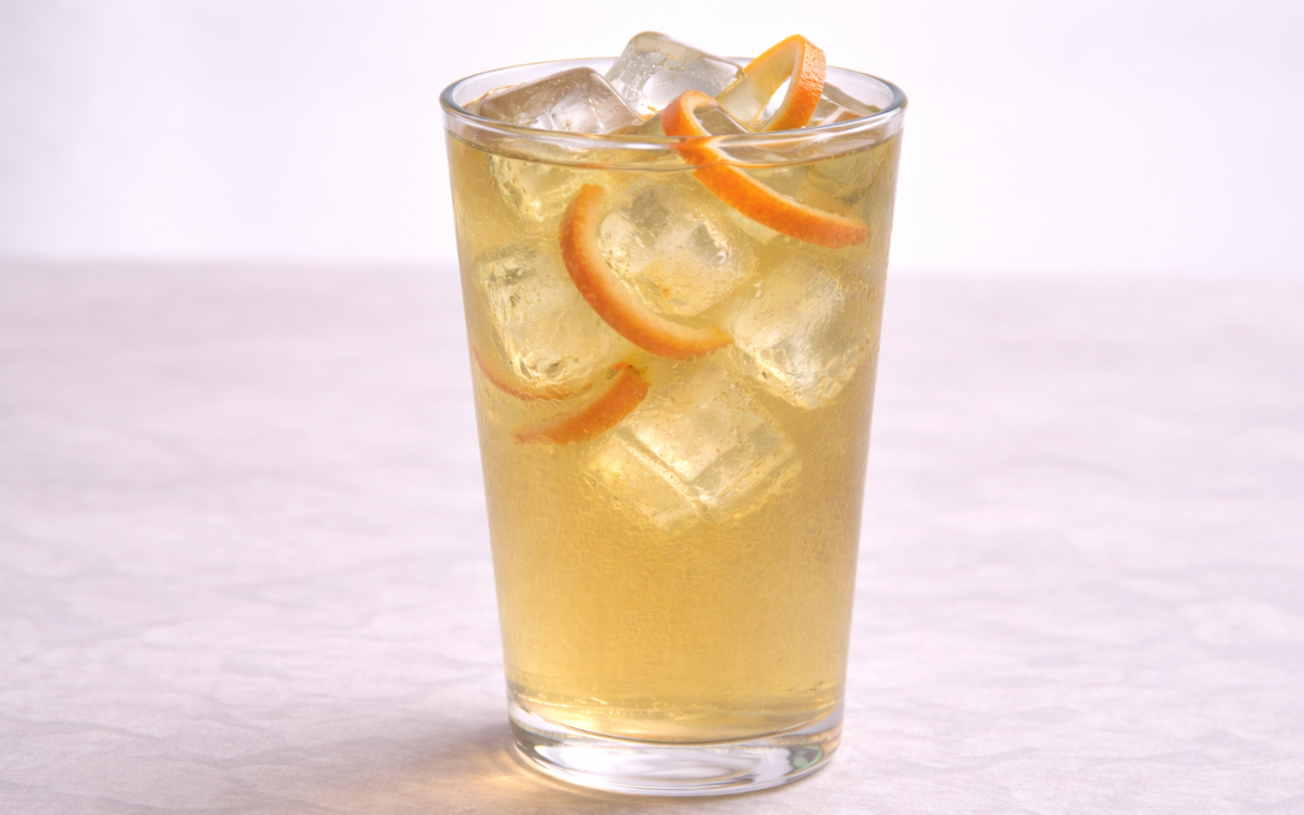 grapefruit green iced tea served over ice with grapefruit peel twists