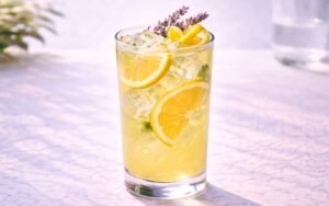 lavender lemonade with lemon slices and lavender sprigs