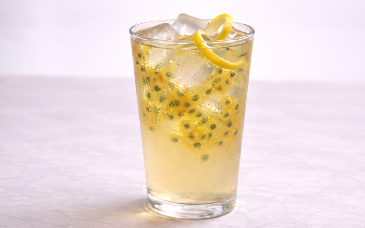 passion fruit white iced tea served over ice with visible passion fruit pulp