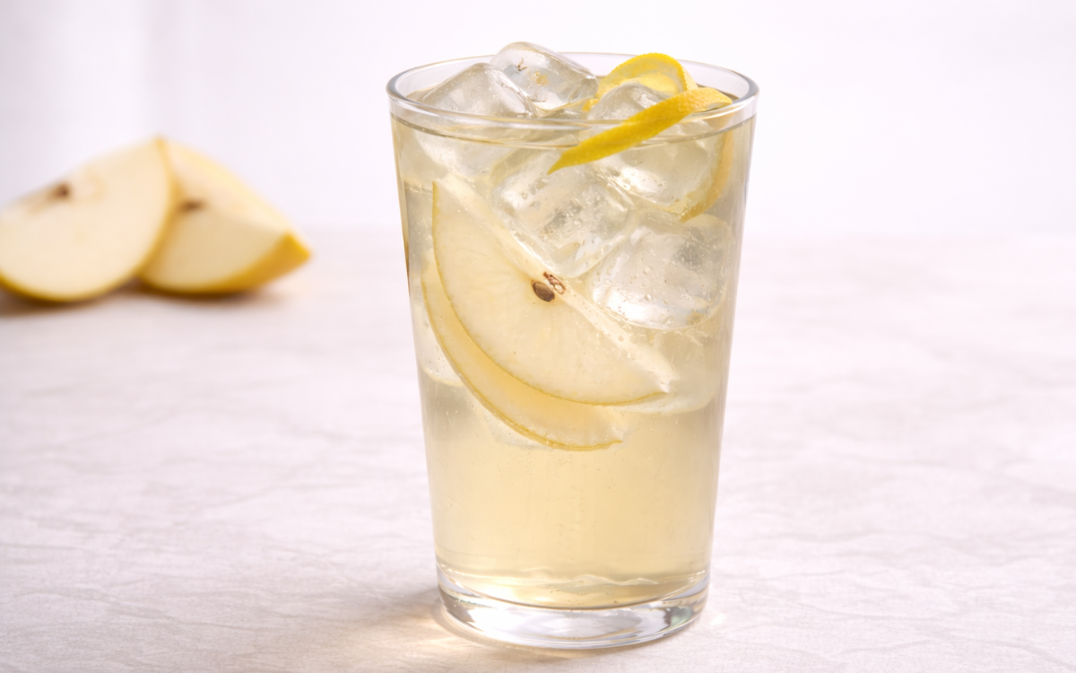 pear white iced tea served over ice with thin asian pear slices and lemon peel twist