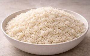 Bowl of fluffy white basmati rice with perfectly separate grains and a fork