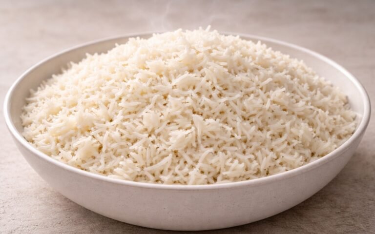 Bowl of fluffy white basmati rice with perfectly separate grains and a fork