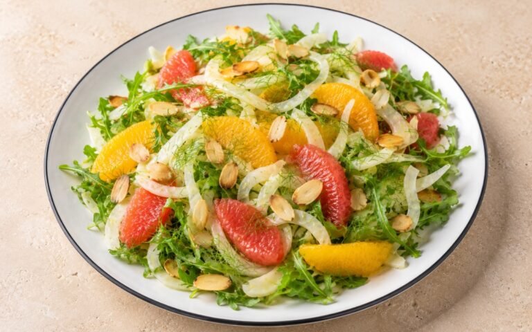 Shaved fennel citrus salad with paper-thin fennel slices, orange and grapefruit segments, and arugula